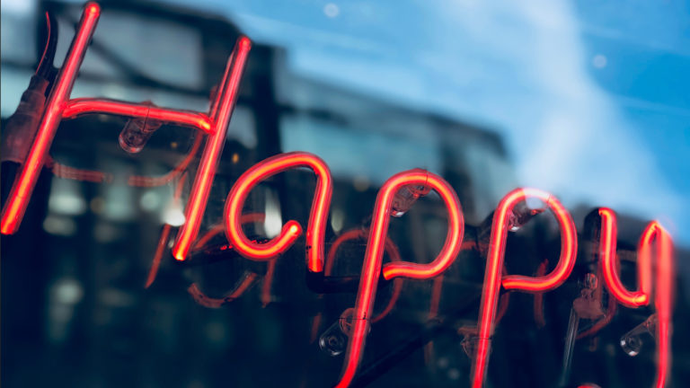 Digital Happiness image of neon lights spelling happy