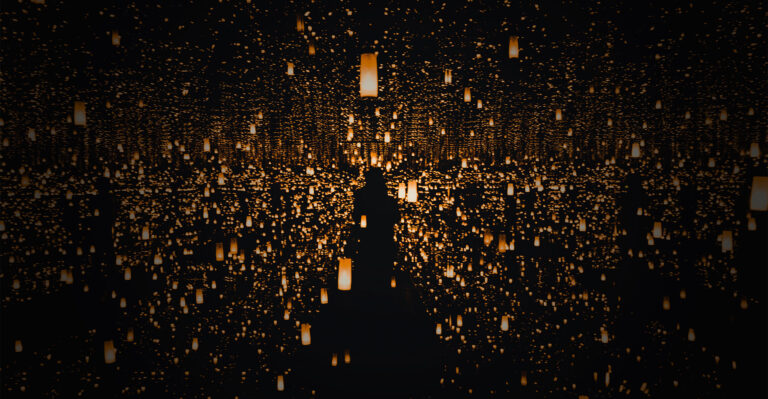 infinity mirror room with lone figure and infinity golden lights